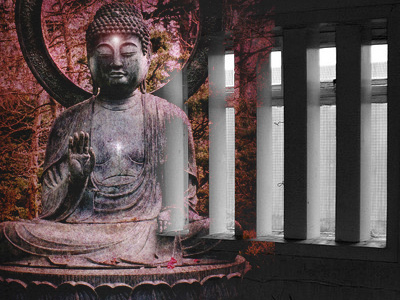 Statue of a buddha superimposed over prison bars.