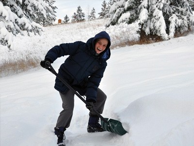 Venerable Jampa shoveling snow.