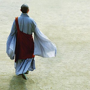 Korean nun, walking alone.