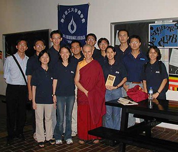 Venerable Thubten Chodron standing with a group of students from Nanyang Technological University Buddhist Society in Singapore.