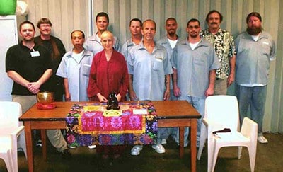 Venerable Chodron standing with inmates at SCCC prison in Licking, Missouri.