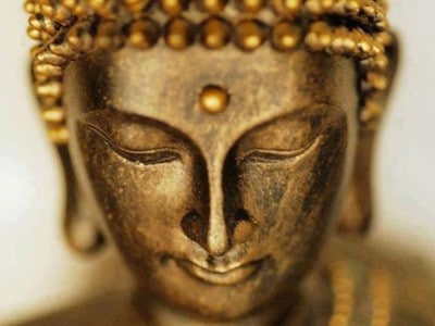 Beautiful golden face of a Buddha.