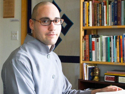 Jon Owen, reading a book at the Abbey.