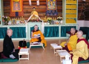 Venerable and three nuns sisting during the Posadha ceremony.