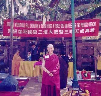 Venerable Chodron standing in front of "the temple".