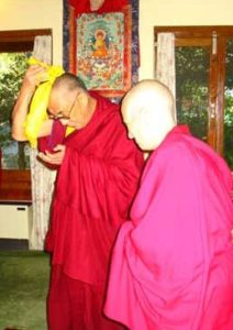 Venerable Chodron standing next to His Holiness.