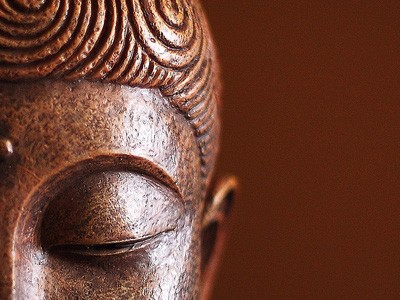 Closeup of the eye of a Buddha statue.