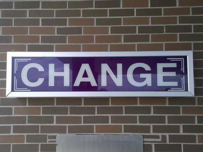 A sign on the wall that says 'Change'.