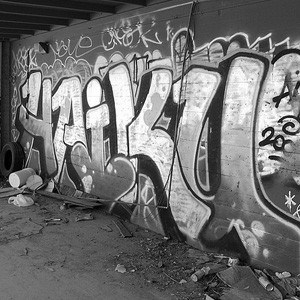 Grafitti of the word 'Haiku' on a wall.