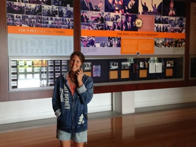 Heather standing in front of an exhibit at the presidential museum.