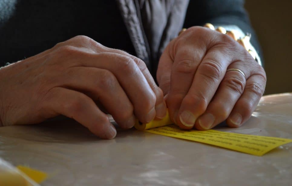 Hands rolling mantras