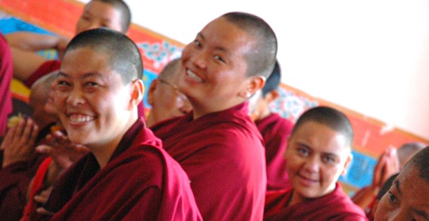 Tibetan nuns smiling.