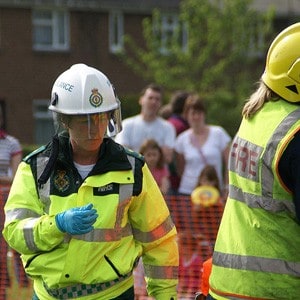 Firefighters helping someone.