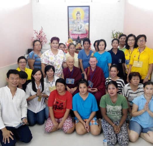 Venerables Chodron and Samten sitting with inmates in Medan women's prison.