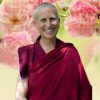 Venerable against background of flowers.