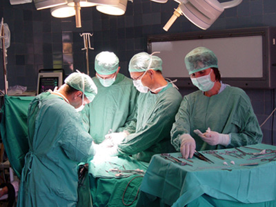 Medical professionals performing surgery.