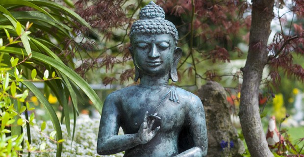 Statue of Buddha in garden.