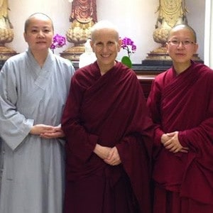 Ven. Chodron standing with a nun from Pu Yi Nunnery and Ven. Damcho.