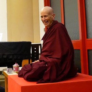Venerable teaching and smiling.