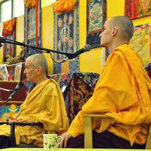 Ven. Tenpa translating for Ven. Chodron at a teaching in Russia.