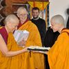 Ven. Jampa giving a gift to Ven. Chodron.