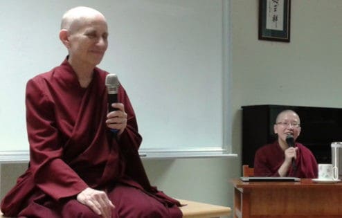 Ven. Chodron teaching with Ven. Damcho translating.