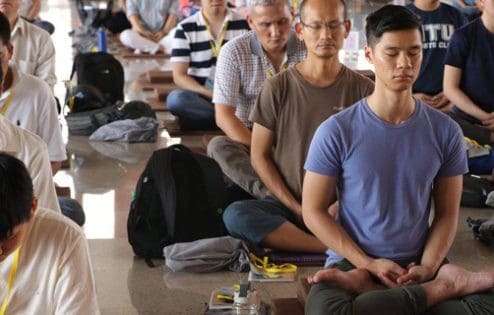 Students sitting in meditative posture.