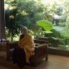 Using the principles of karma to our advantage Venerable teaching in front of a large Buddha statue.