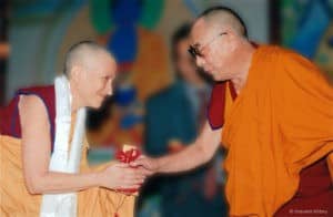 Ven. Chodron presenting an offering to His Holiness the Dalai Lama in 2008.