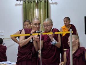 Tibetan nuns performing an experiment.