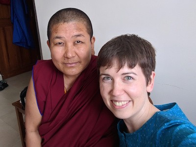 Dr. Ackerman posing for photo with Tibetan nun.