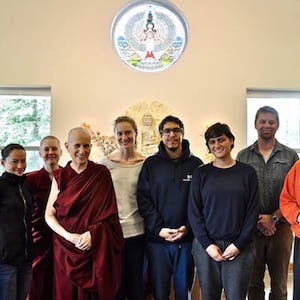Venerable Chodron standing with participants of the 2018 Young Adult Week.