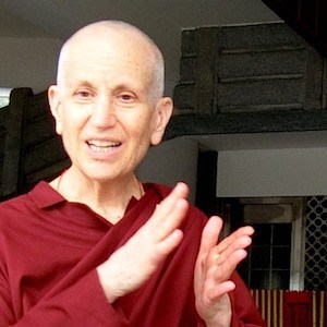 Venerable Chodron speaking and gesturing with hands.