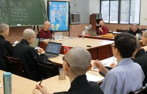 Venerable teaching to a group of nuns.