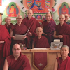 Sravasti Abbey monastics standing together in a group.