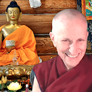 Venerable sitting next to the Buddha, smiling while giving a teaching.