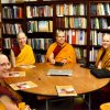 A group of shiksamanas in the Abbey library reading their precepts at the round table.