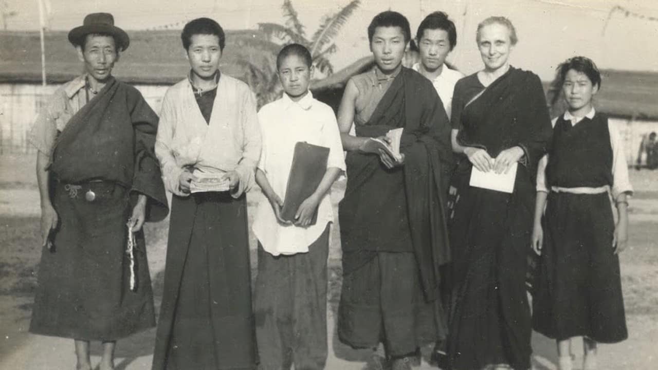 Freda Bedi standing with a group of Tibetans at Buxa.
