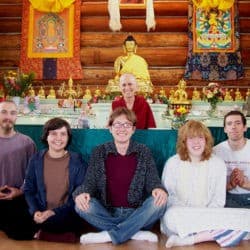Venerable Chodron and Young Adult Week participants take a group photo in the Sravasti Abbey Meditation Hall.