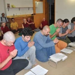Exploring Monastic Life participants kneel to request for training from the Sravasti Abbey community.