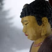 Close up on Buddha statue.