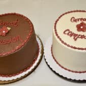 Two cakes that say "Great Compassion."