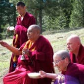 Khensur Jampa Tegchok out on the meadow with monastics doing a tantric ritual.