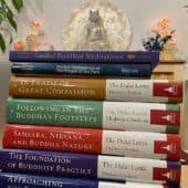 A stack of volumes of books from the Library of Wisdom and Compassion.