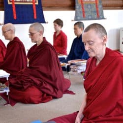 Monastics and lay trainees sit in meditation in the Sravasti Abbey Meditation Hall.