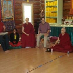 EML participants sit in a circle for a group discussion in the Meditation Hall.