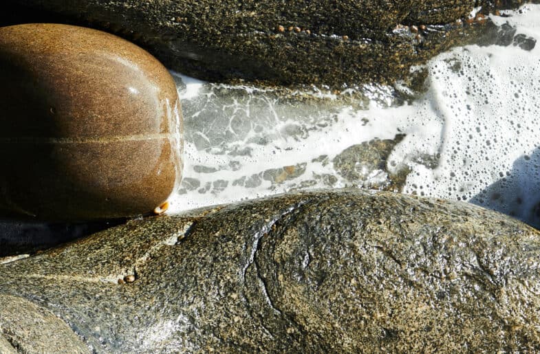 Foam and rocks in river